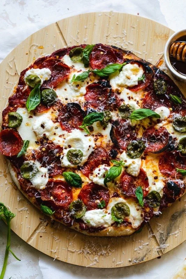 Pepperoni Pizza with Hot Honey Ricotta Olives and Basil