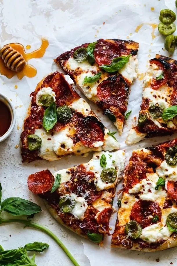 Pepperoni Pizza with Hot Honey Ricotta Olives and Basil