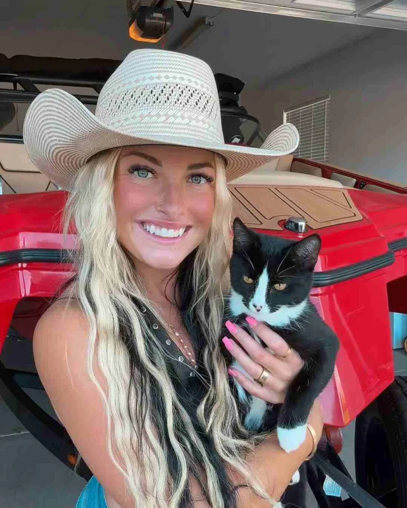 Zona Mae with her cat redbull